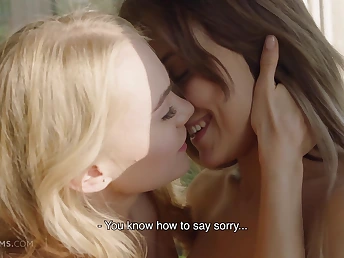 Two naked nymphs making out energetically on the bed